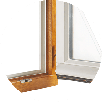 A detail view of a wood window showing a different color on the inside and outside.