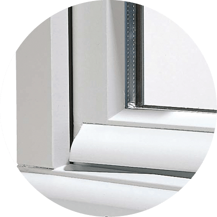 A detail view of a historical jet d’eau wood window and door style.