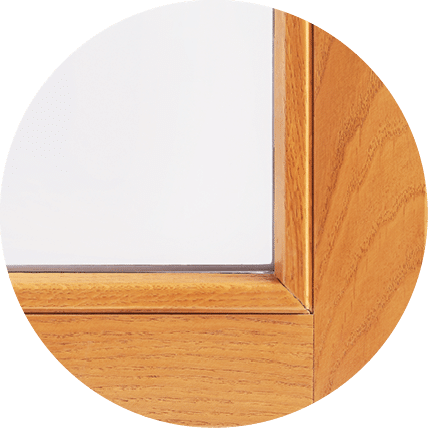A detail view of a modern straight line wood window and door style.
